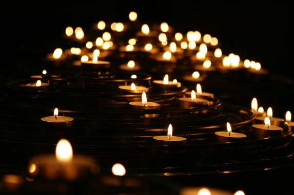 burning candle lights in the water, moving away from abuse towards love