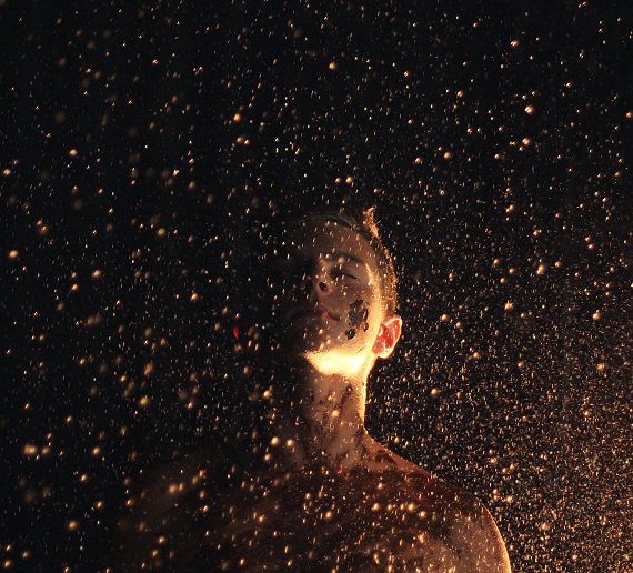 a woman standing in front of the night sky, seems like it's raining gold, symbolizing how to be a better mom